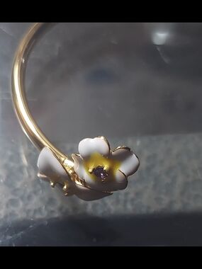 kate spade Gold Floral Bracelet with White and Yellow Enamel and Purple Center